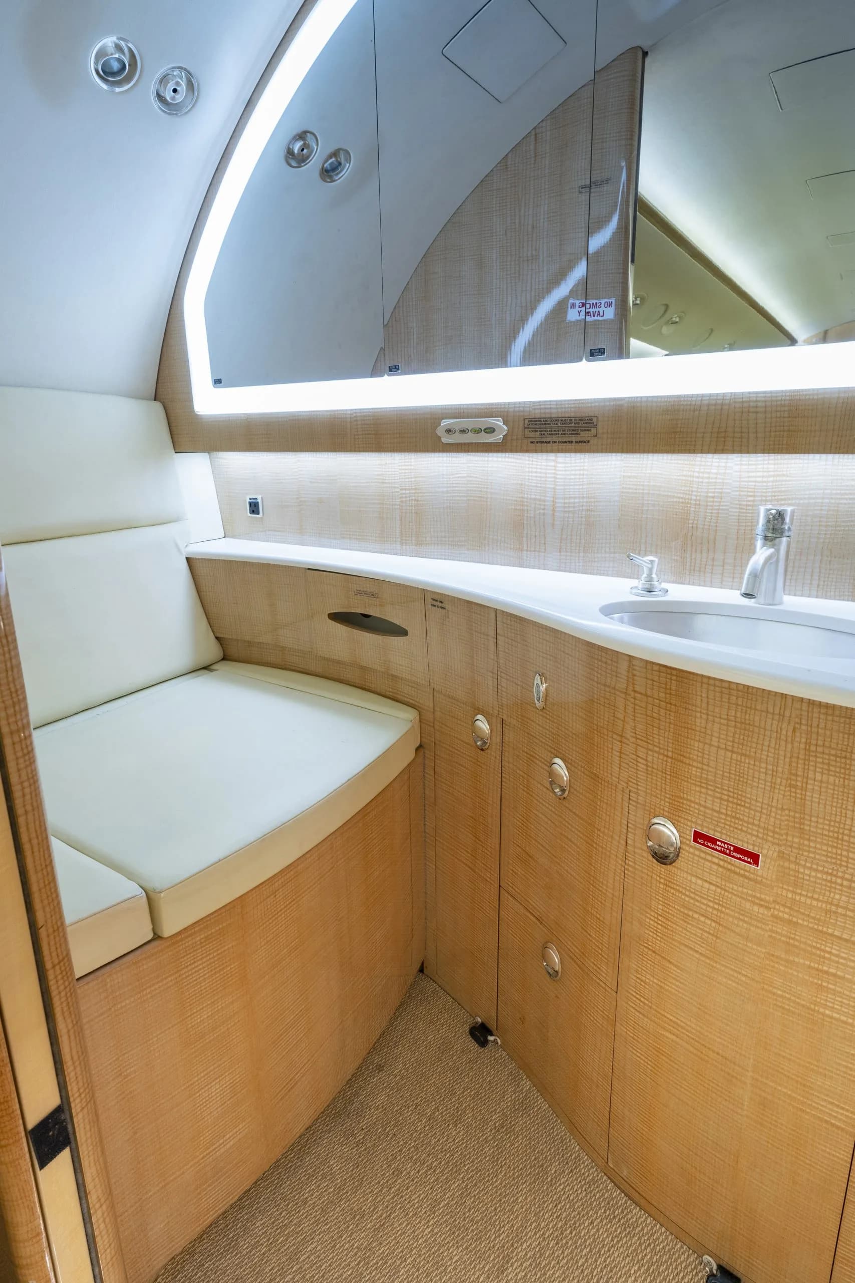 The aircraft's lavatory features a sink and storage.