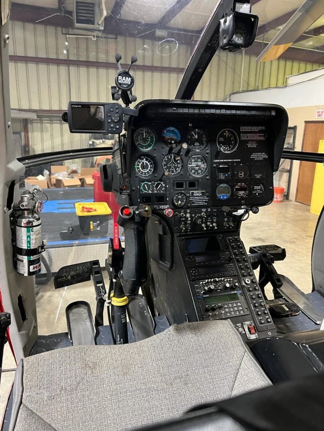 The instrument panel and controls inside the cockpit of the helicopter.