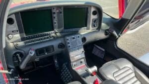 View of the cockpit of a Cirrus SR22G6 aircraft, showing the instrument panel and controls.