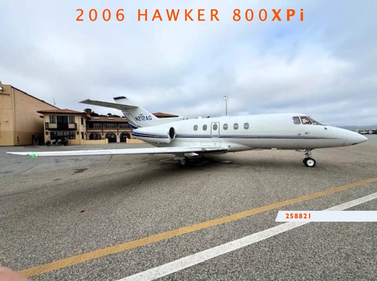 A 2006 Hawker 800XPi aircraft is parked on the tarmac.