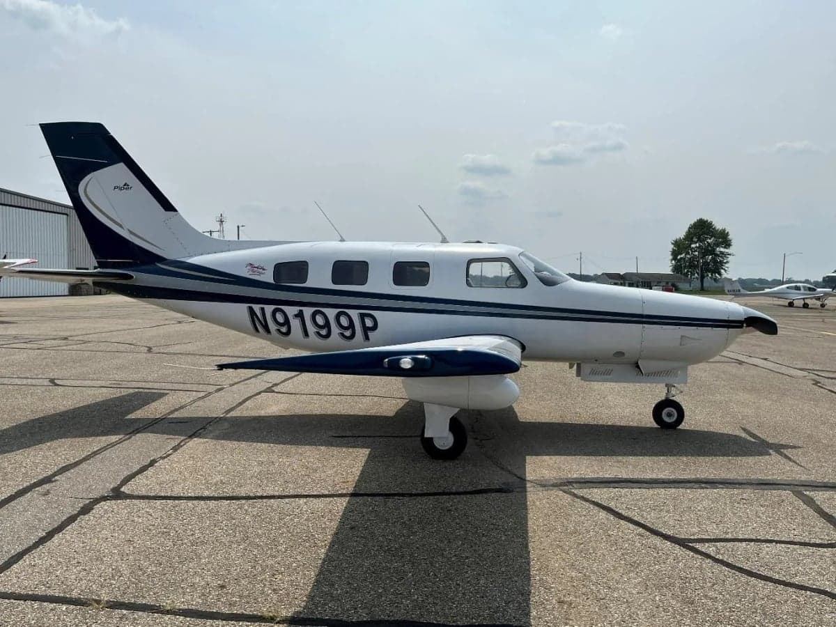 Side view of the Malibu Mirage aircraft N9199P on the tarmac.