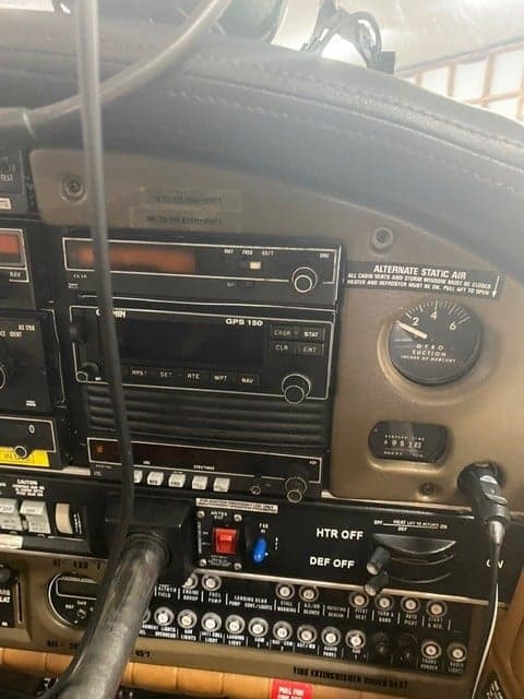 Close-up of the aircraft's instrument panel, showing the avionics and controls.
