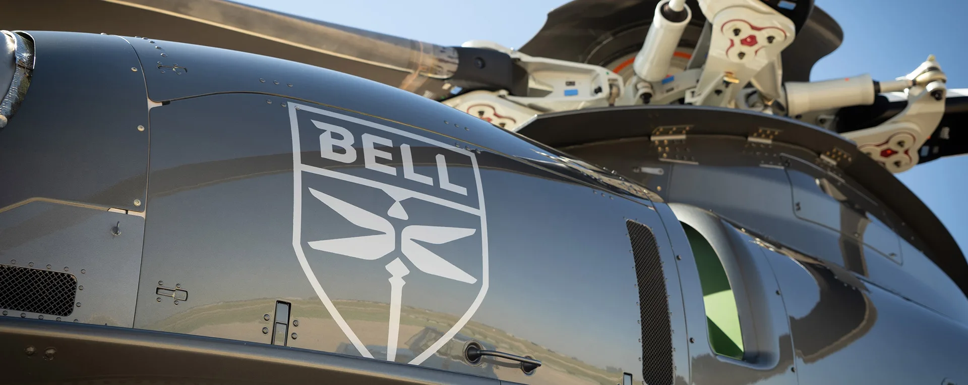 Close up of the Bell logo on the side of a helicopter.