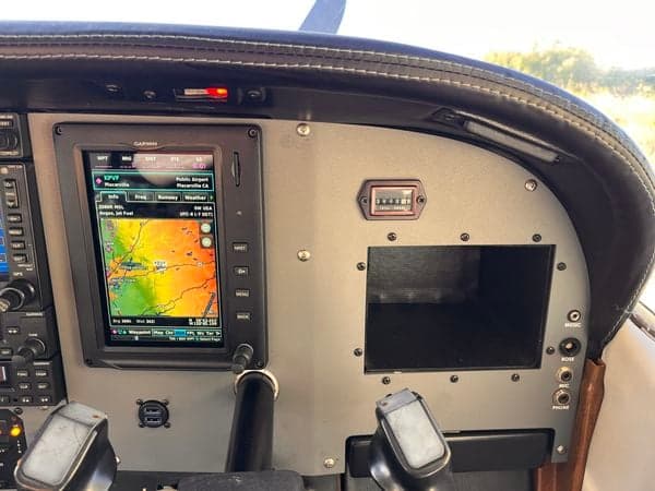 Instrument panel of N738JZ, showing Garmin display and Hobbs meter.