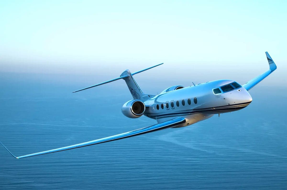 A Gulfstream G700 in flight over the ocean.