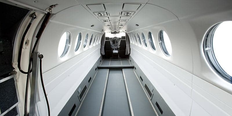 Interior view of the King Air 350 cabin looking towards the cockpit.