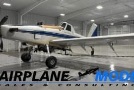 Cropduster aircraft in a hangar with blue and white paint scheme.