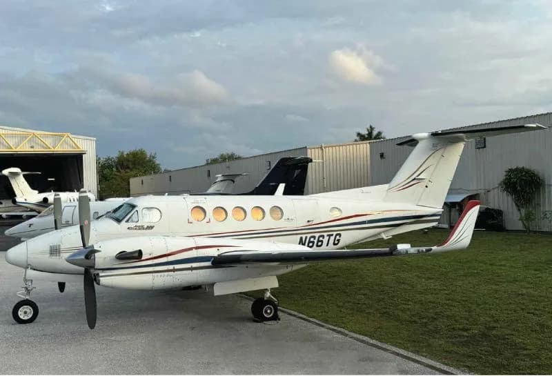A King Air 200 aircraft with registration N66TG parked on the tarmac.