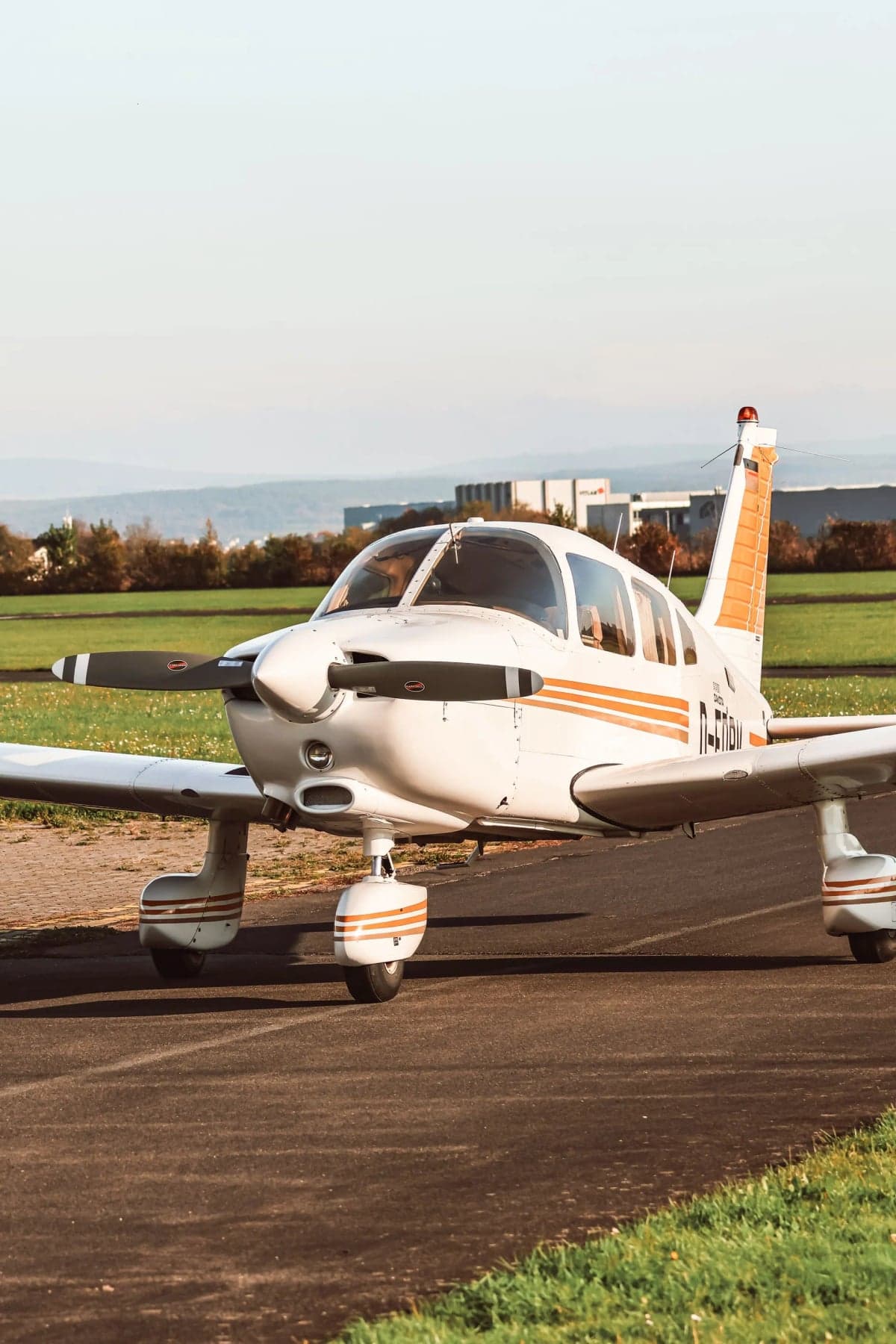 Piper Dakota D-EDBV with orange stripes on the tarmac.