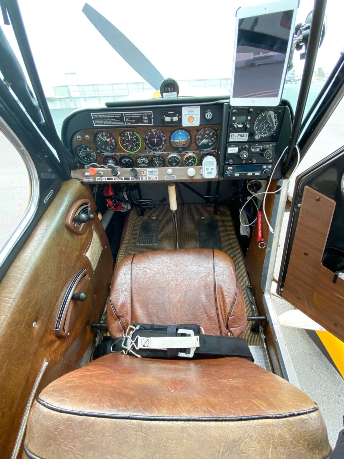 View of the cockpit of the aircraft, showing the instrument panel and seat.