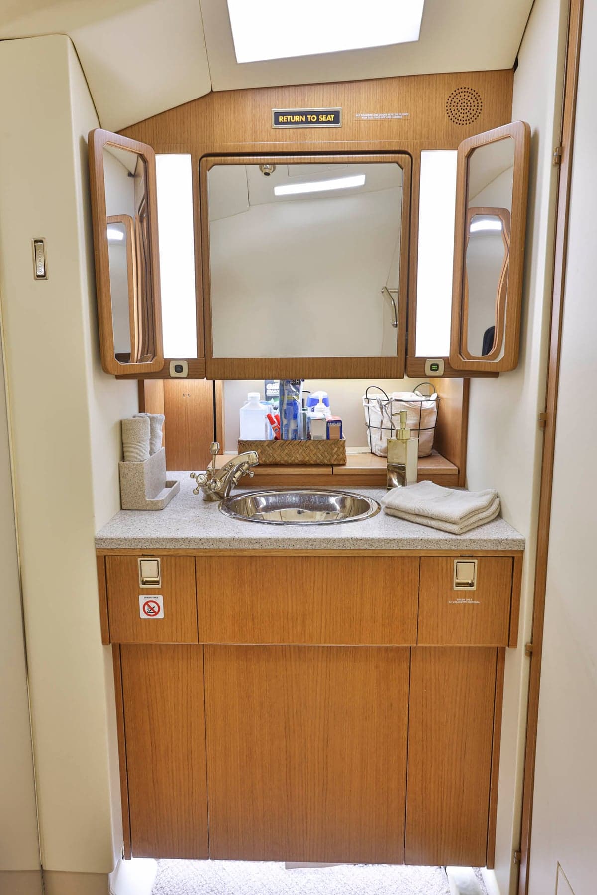 A lavatory sink and vanity inside the aircraft.