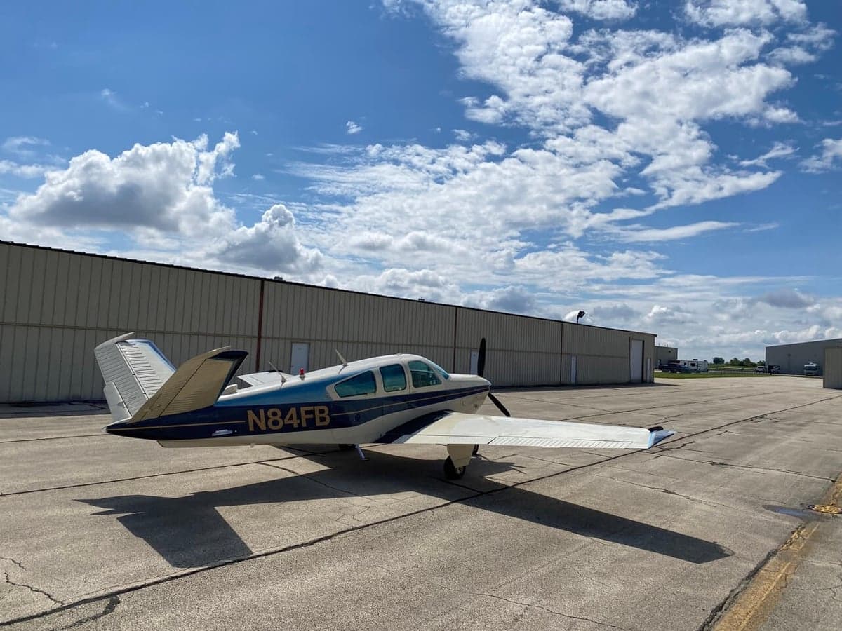 A Beechcraft Bonanza N84FB parked on the tarmac.