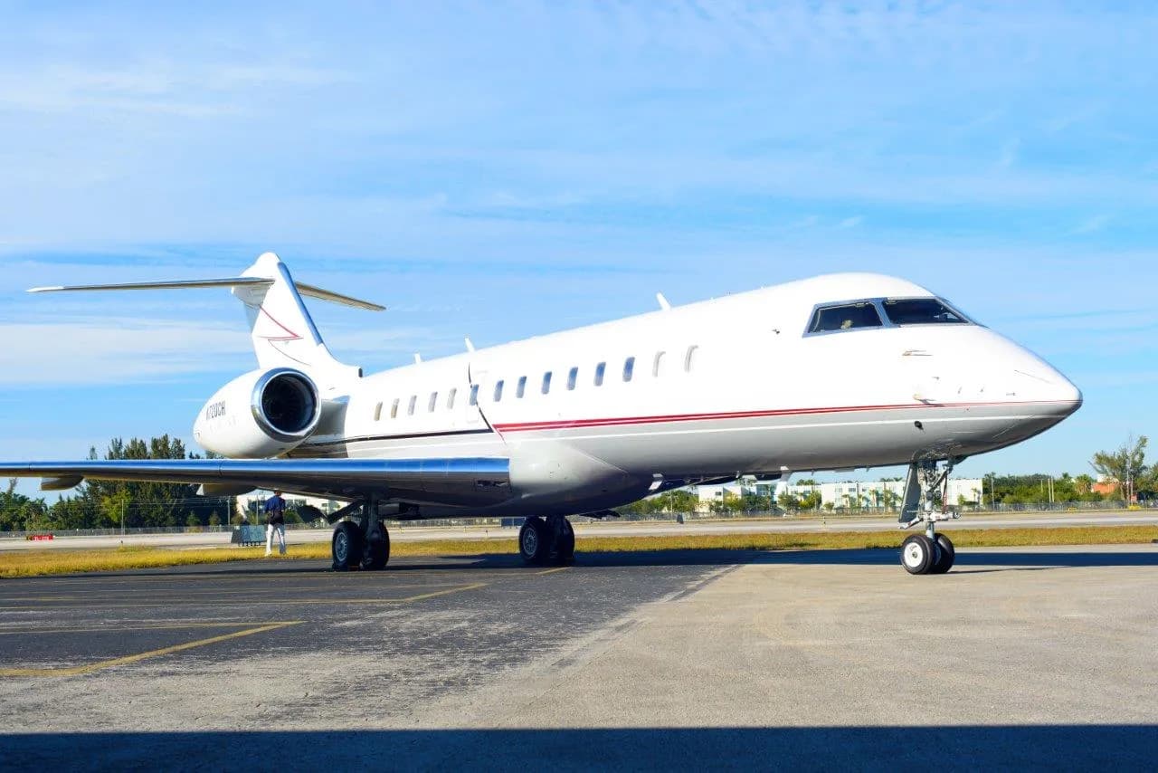 A Bombardier Challenger aircraft is parked on the tarmac.