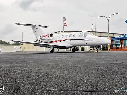 A Cessna Citation CJ1+ aircraft with registration N608MM parked on the tarmac.