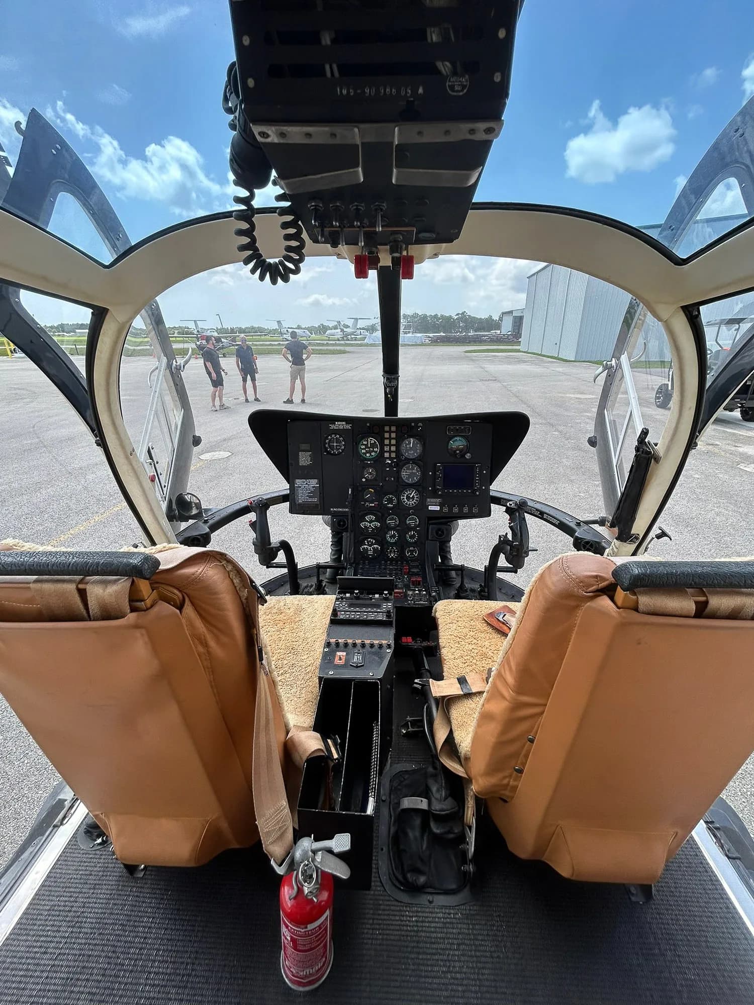 View of the helicopter's cockpit instrument panel from the pilot's seat.