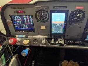 Close-up of the aircraft's instrument panel featuring multiple displays and gauges.
