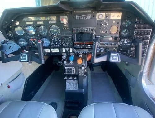 The cockpit features a full instrument panel and dual control yokes.