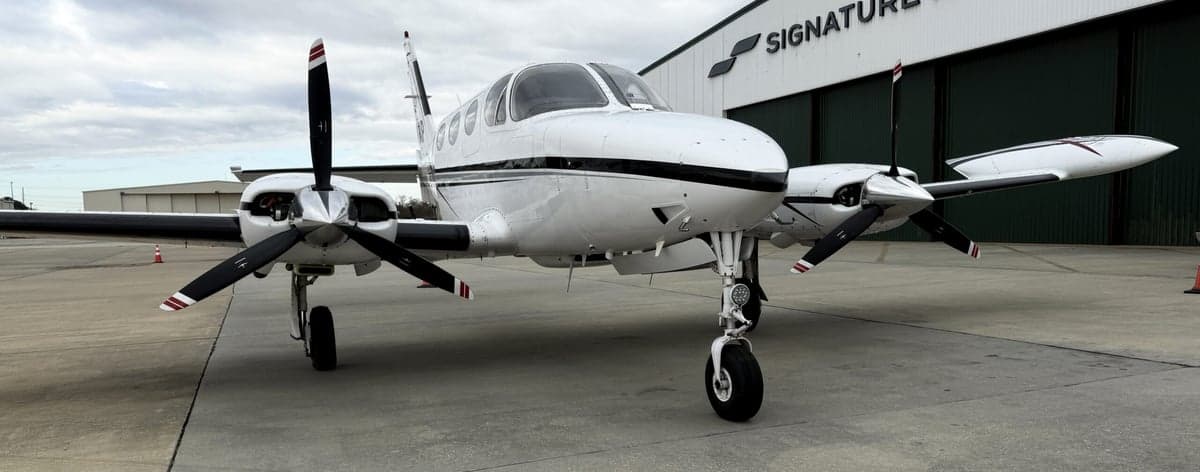 Front view of the Cessna 340A aircraft with registration N51AP parked on the tarmac.