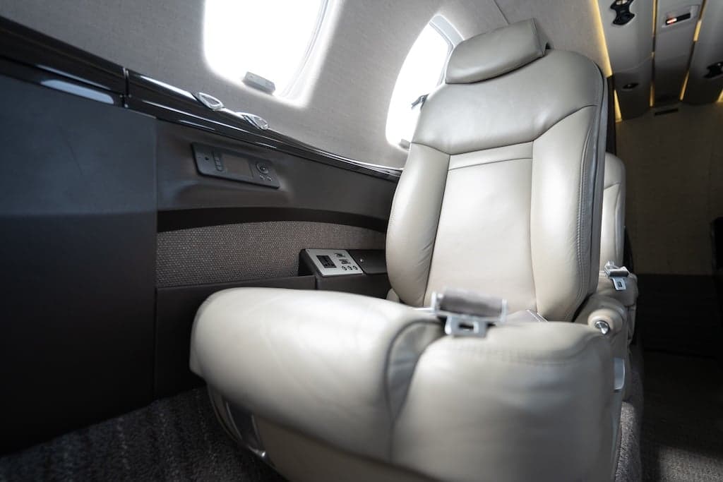 Close-up of a leather seat inside the aircraft cabin.