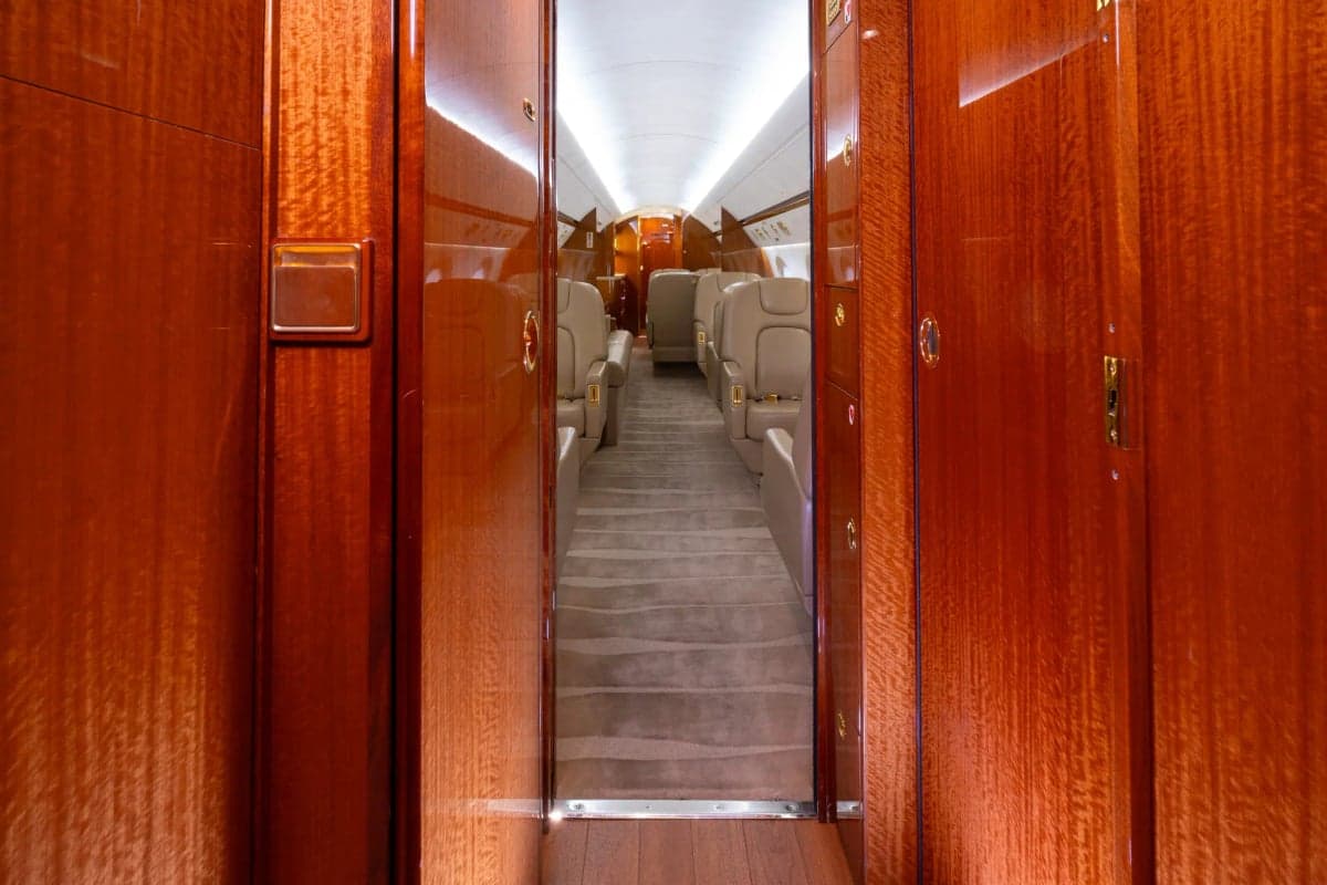 View of the Gulfstream G450 cabin interior through wooden doors.