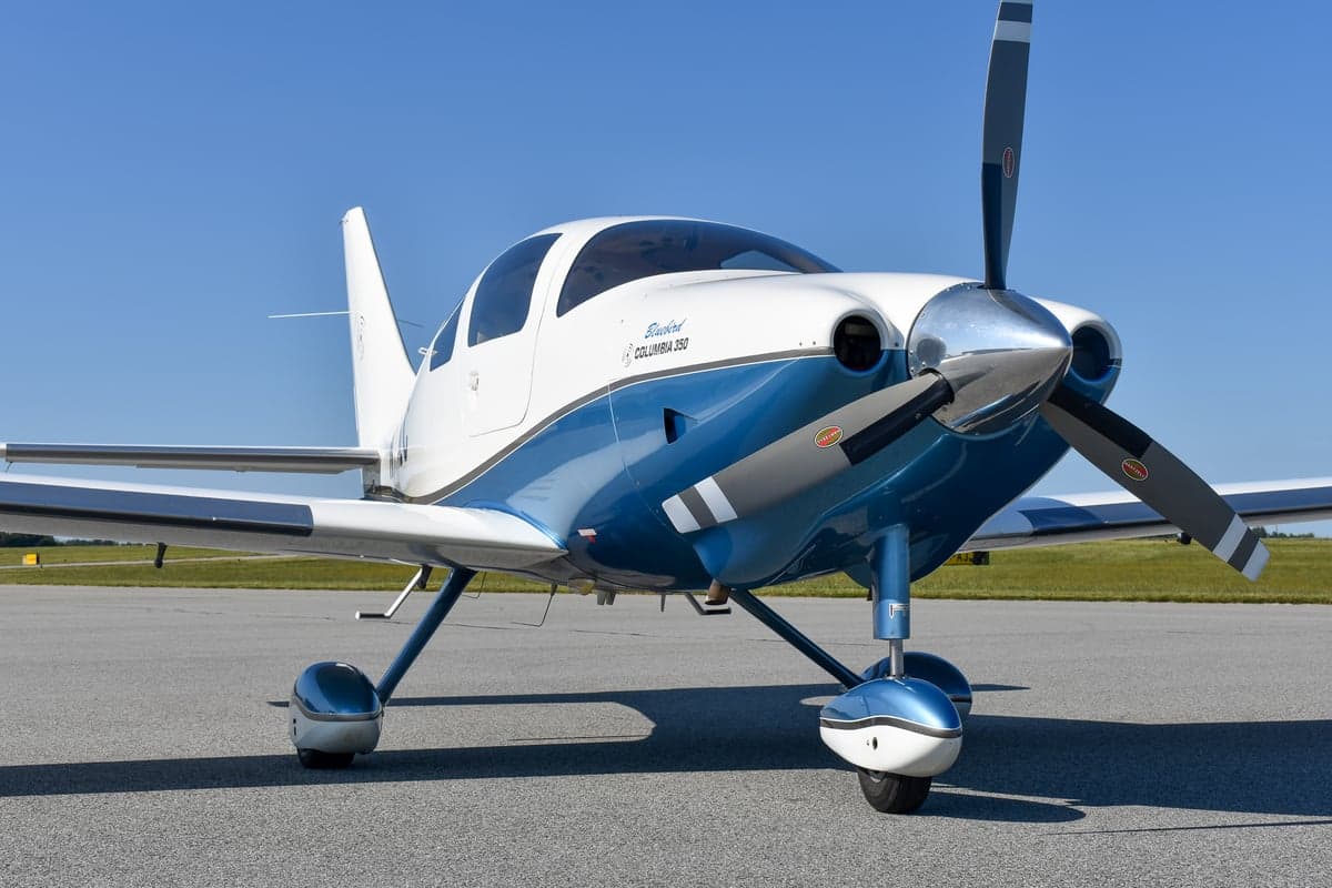 Side view of a Bluebird Columbia 350 aircraft with registration N151LC on the tarmac.