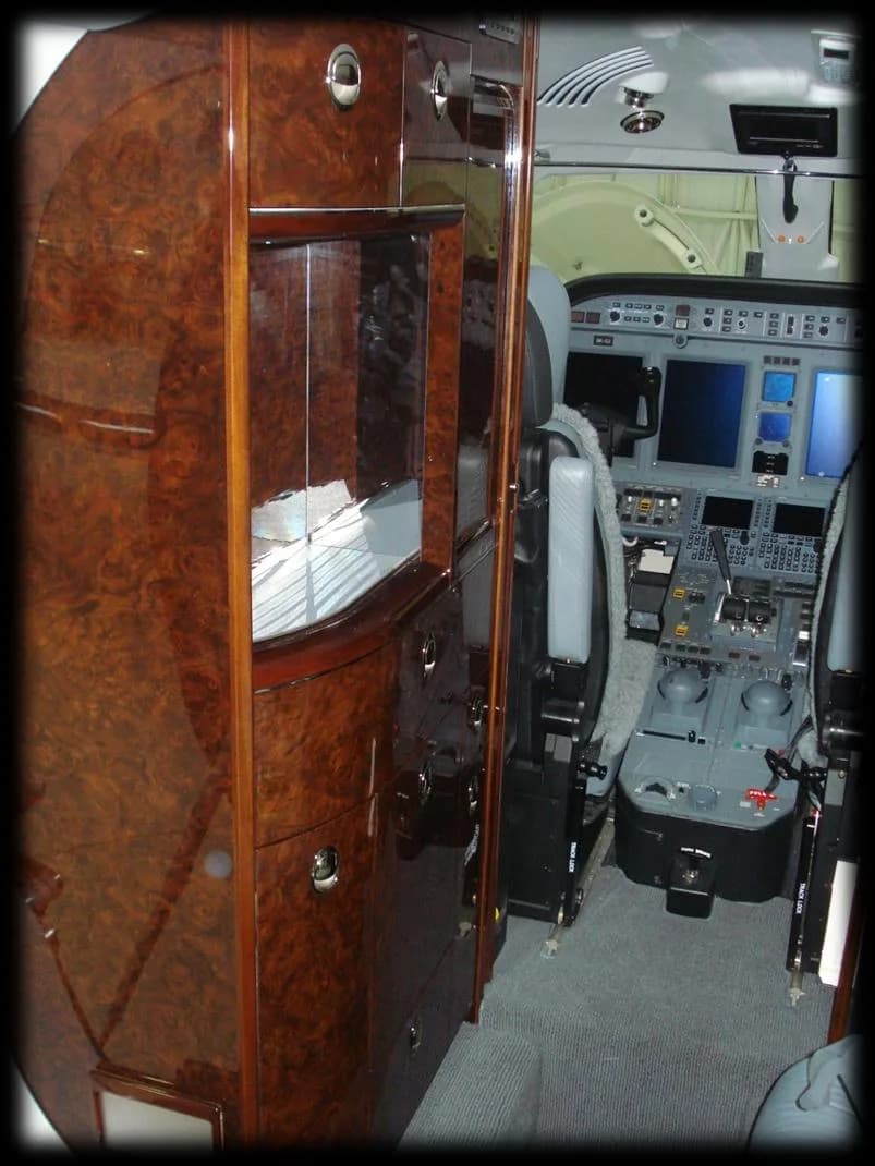View of the cabin storage and cockpit of the aircraft.