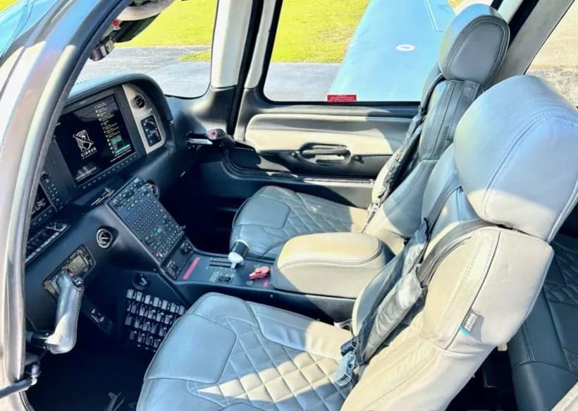 View of the front seats and cockpit area of the aircraft.