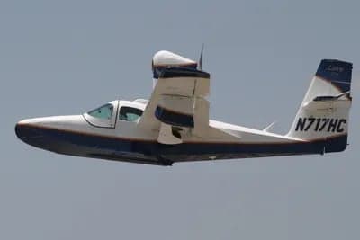 Lake amphibian aircraft in flight with registration N717HC.
