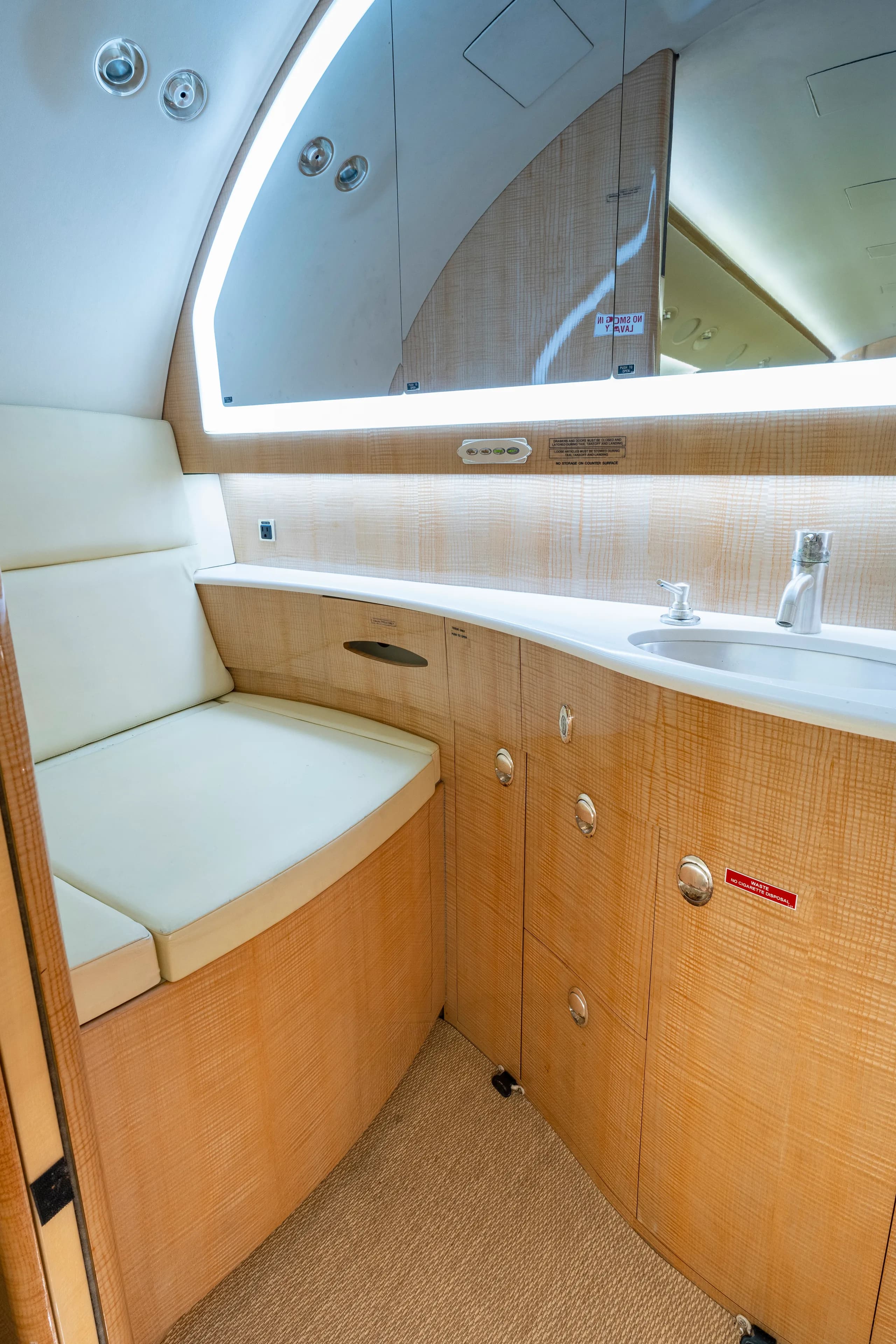 The aircraft's lavatory features a sink and storage.