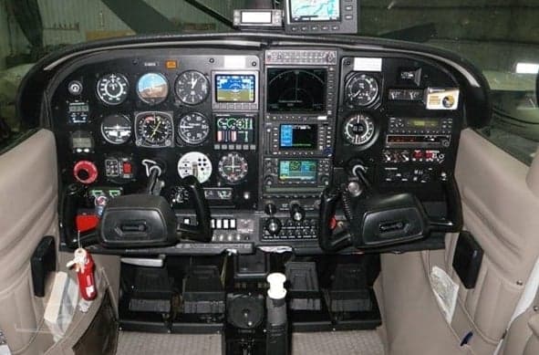 Detailed view of the Cessna 206 instrument panel.
