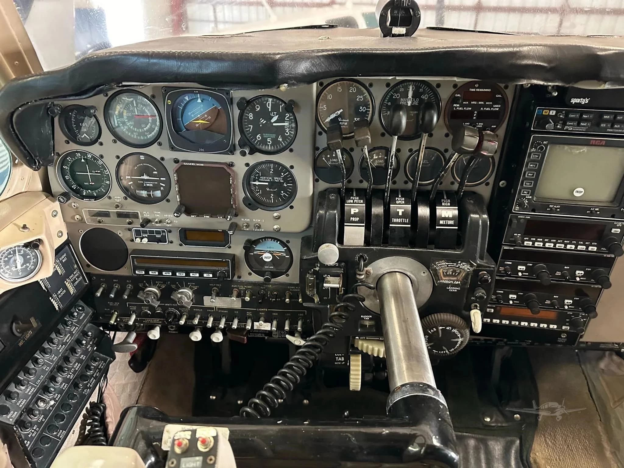 A detailed view of the aircraft's cockpit, focusing on the pilot's side instrument panel and controls.