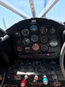 Close-up of the instrument panel inside the cockpit of an aircraft.