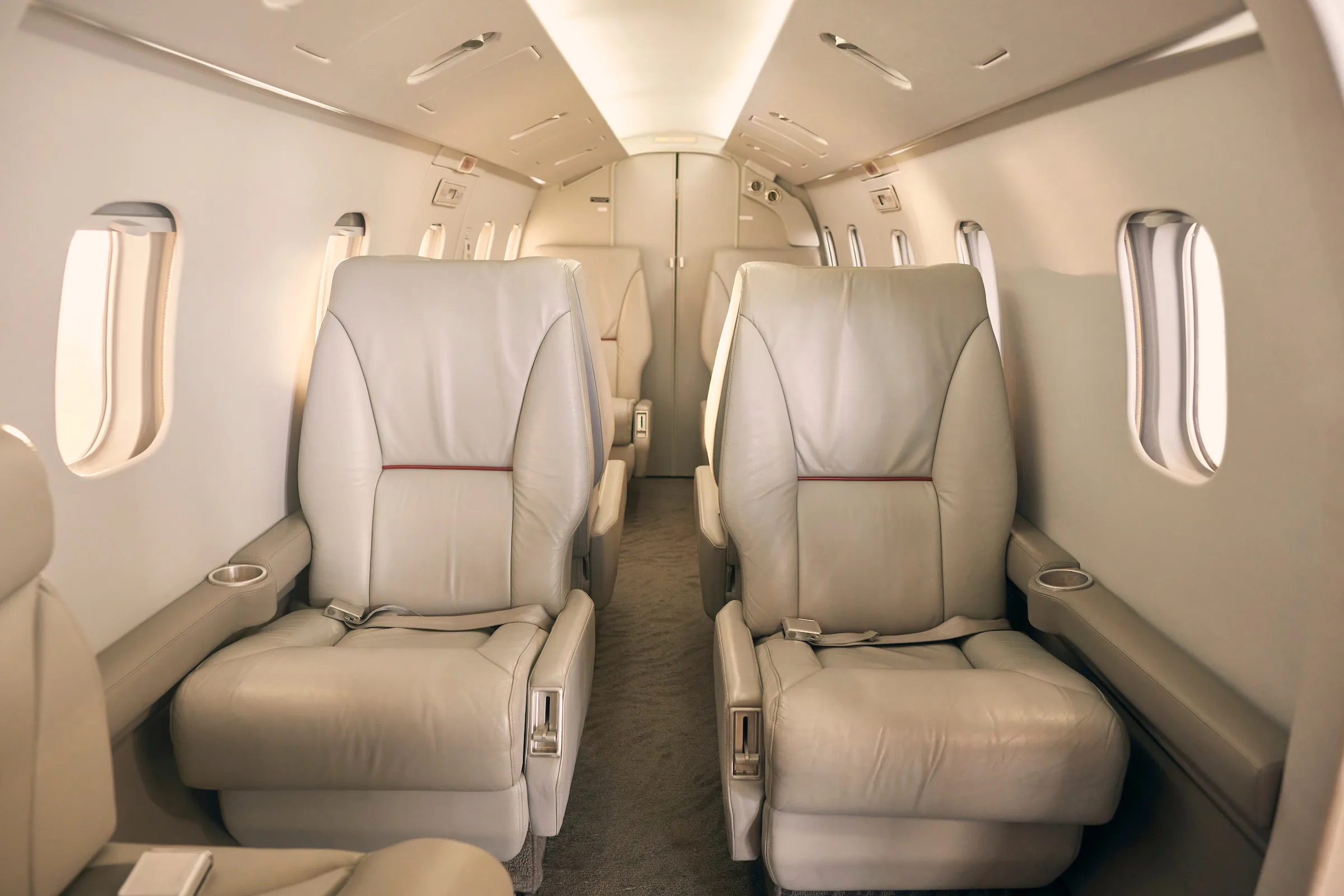 The interior of a Westwind Astra SPX aircraft, showing the cabin seats and layout.