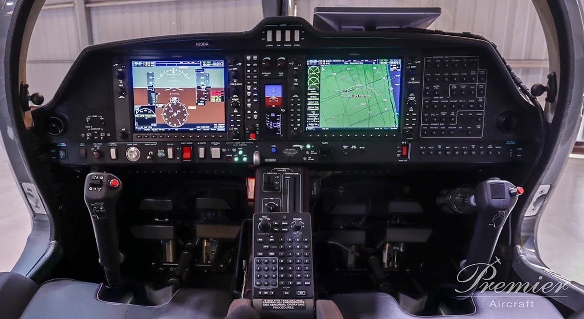 The cockpit of a Diamond DA62 aircraft features a modern glass panel display.