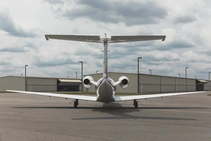 Rear view of a Cessna Citation jet on the tarmac.