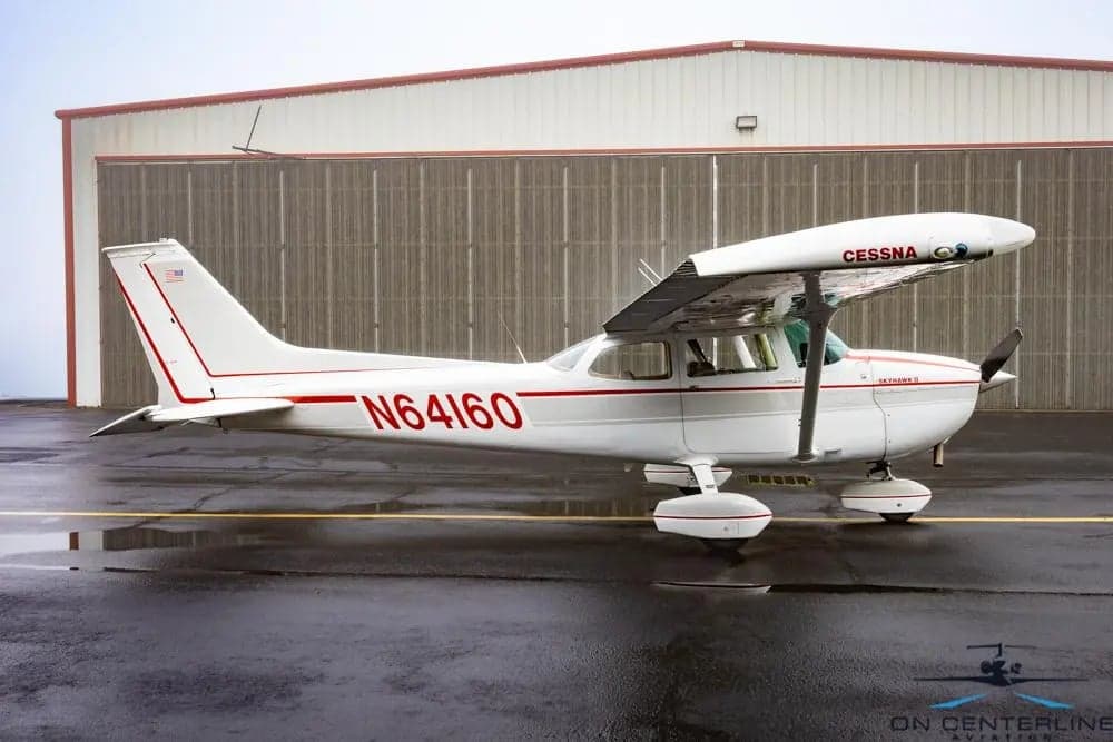 Side view of a Cessna 172 Skyhawk with registration number N64160.