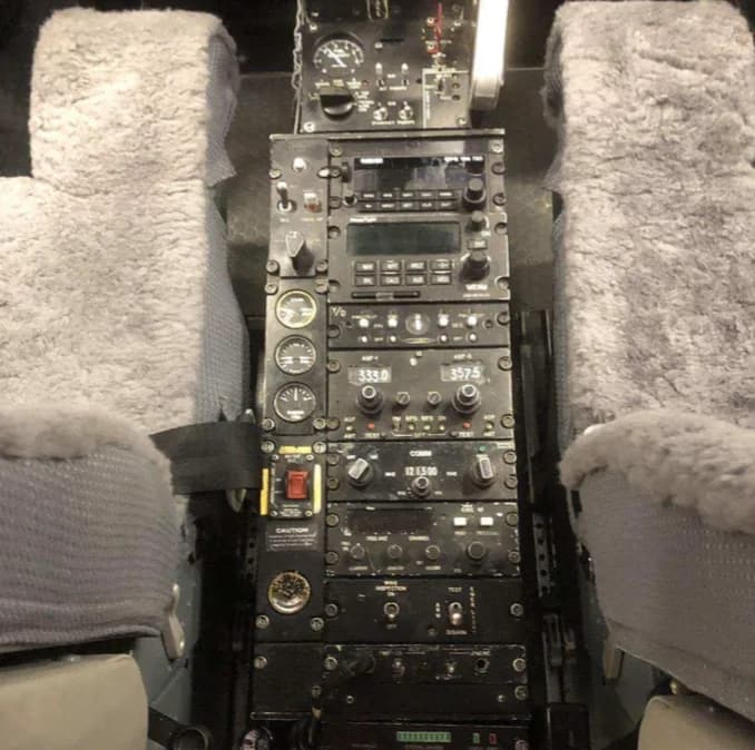 Close-up of the aircraft's center console and instrument panel.