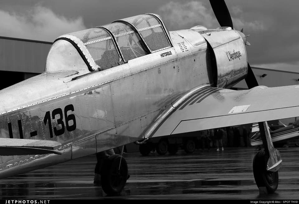 Potez 58 aircraft in flight with Swiss markings.