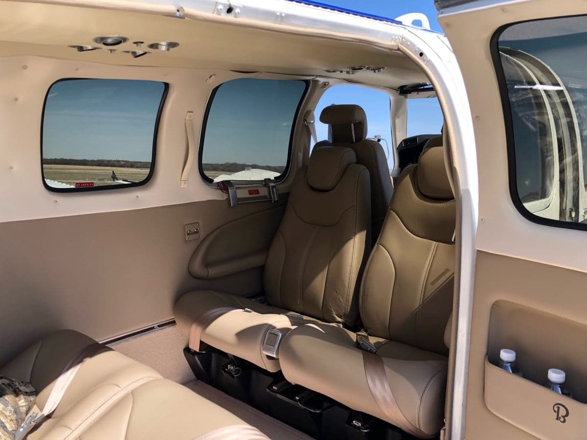 Interior view of the Beechcraft Baron's cabin with tan leather seats.