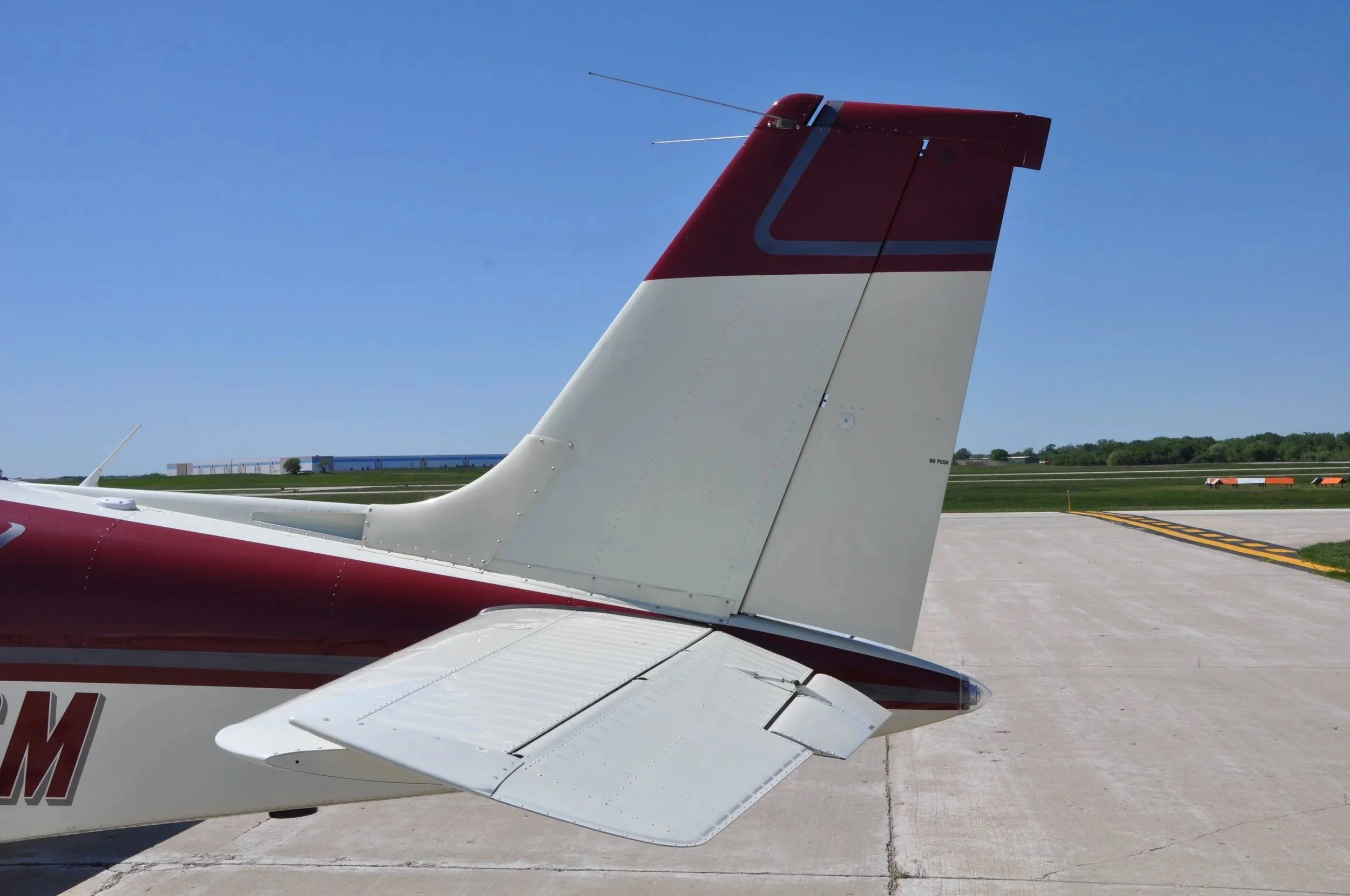 A close-up view of the vertical and horizontal stabilizers of the Beechcraft Bonanza F33A N159GM.