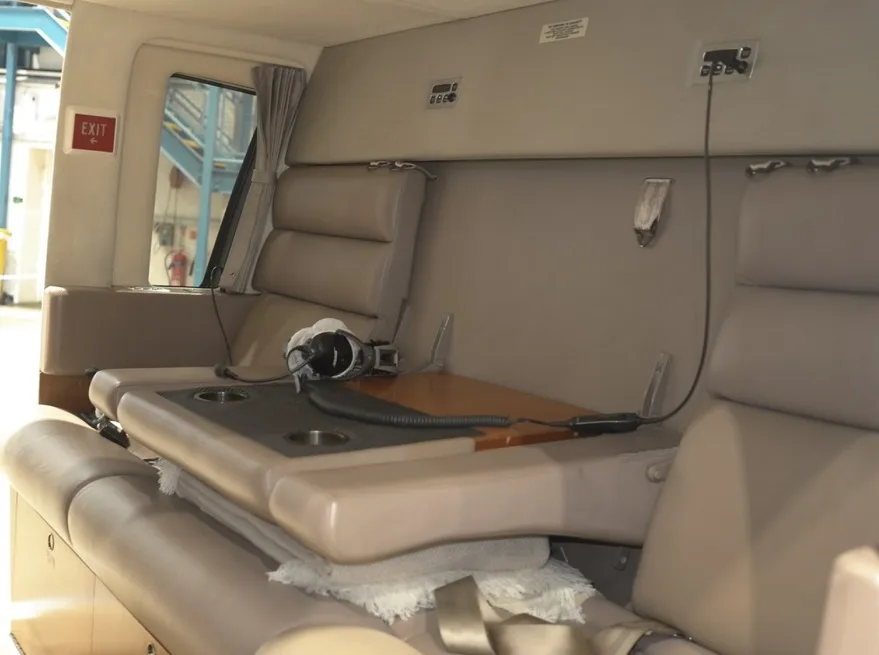 View of the helicopter's cabin seats and table.