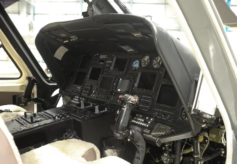 View of the helicopter's instrument panel and controls.