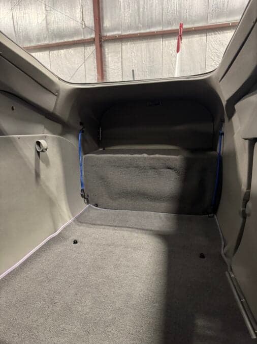 The rear cargo area of the Cessna 206 is shown.