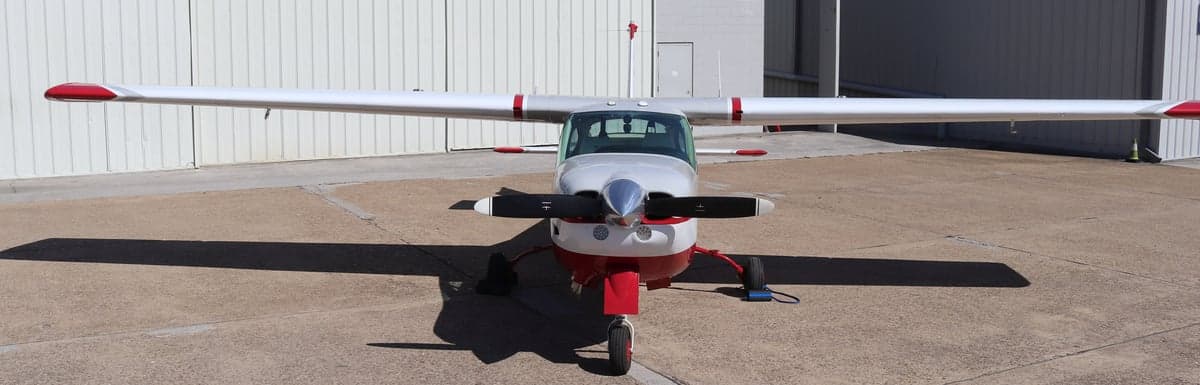 Front view of the Cessna N878JM on the ground.