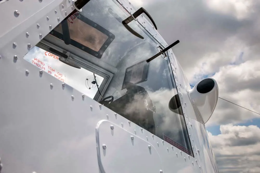 Close-up of the cockpit window of an Air Tractor crop duster.
