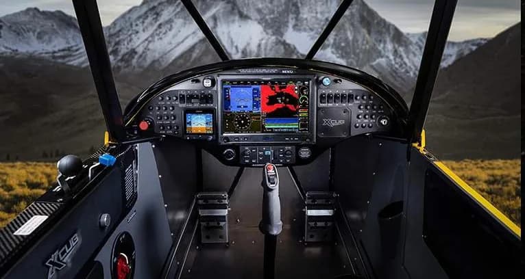 View of the instrument panel and cockpit of an XCub aircraft.