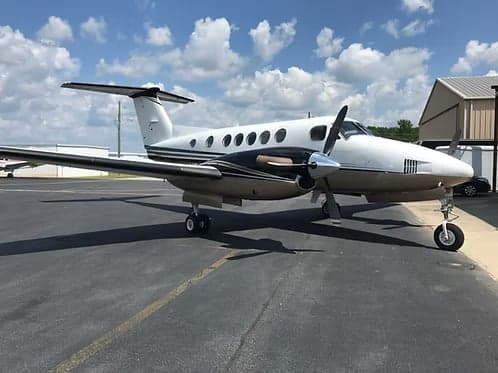 A King Air turboprop aircraft parked on the tarmac.