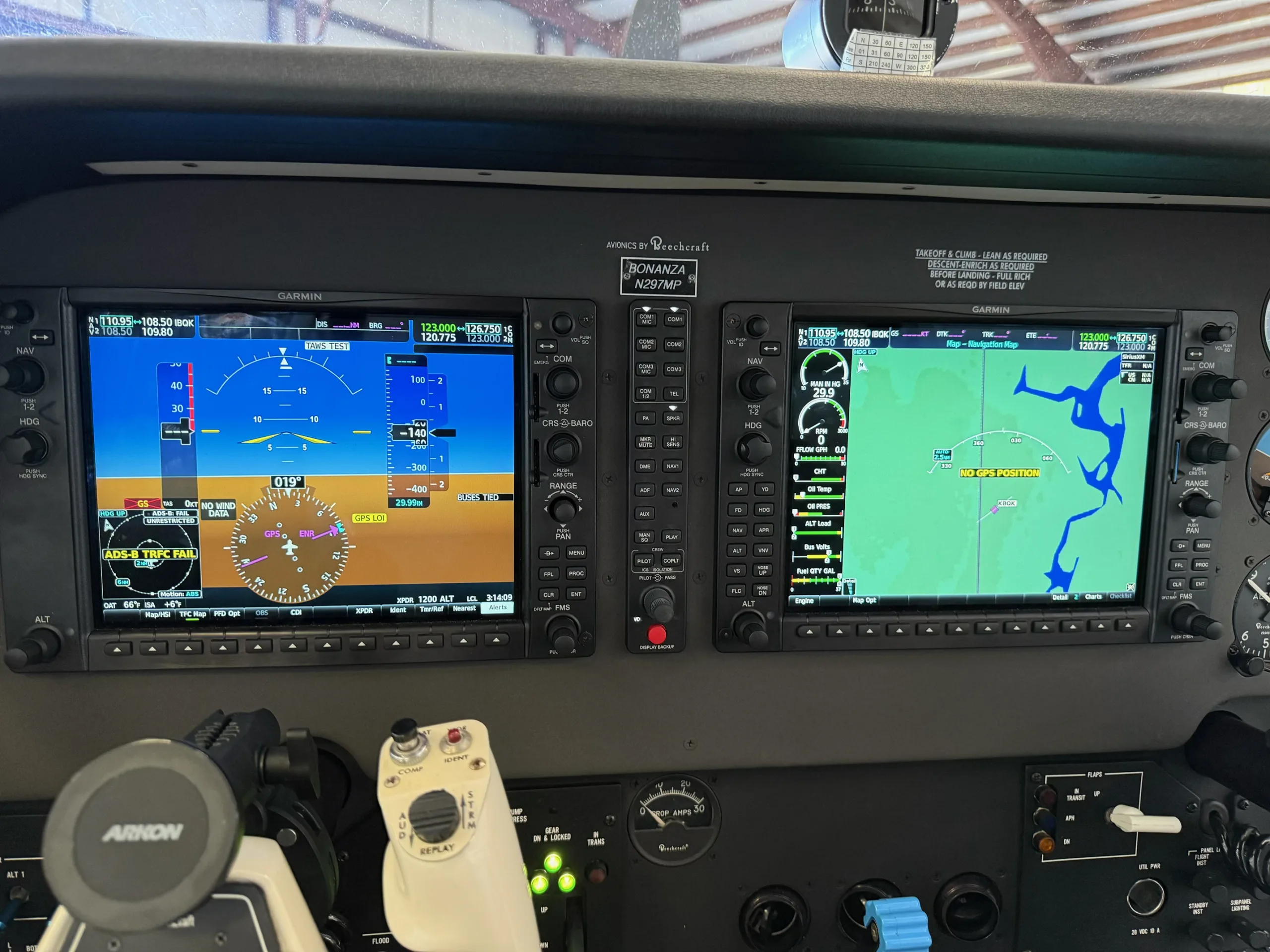 The modern glass cockpit of a Beechcraft Bonanza N297MP with dual Garmin displays.
