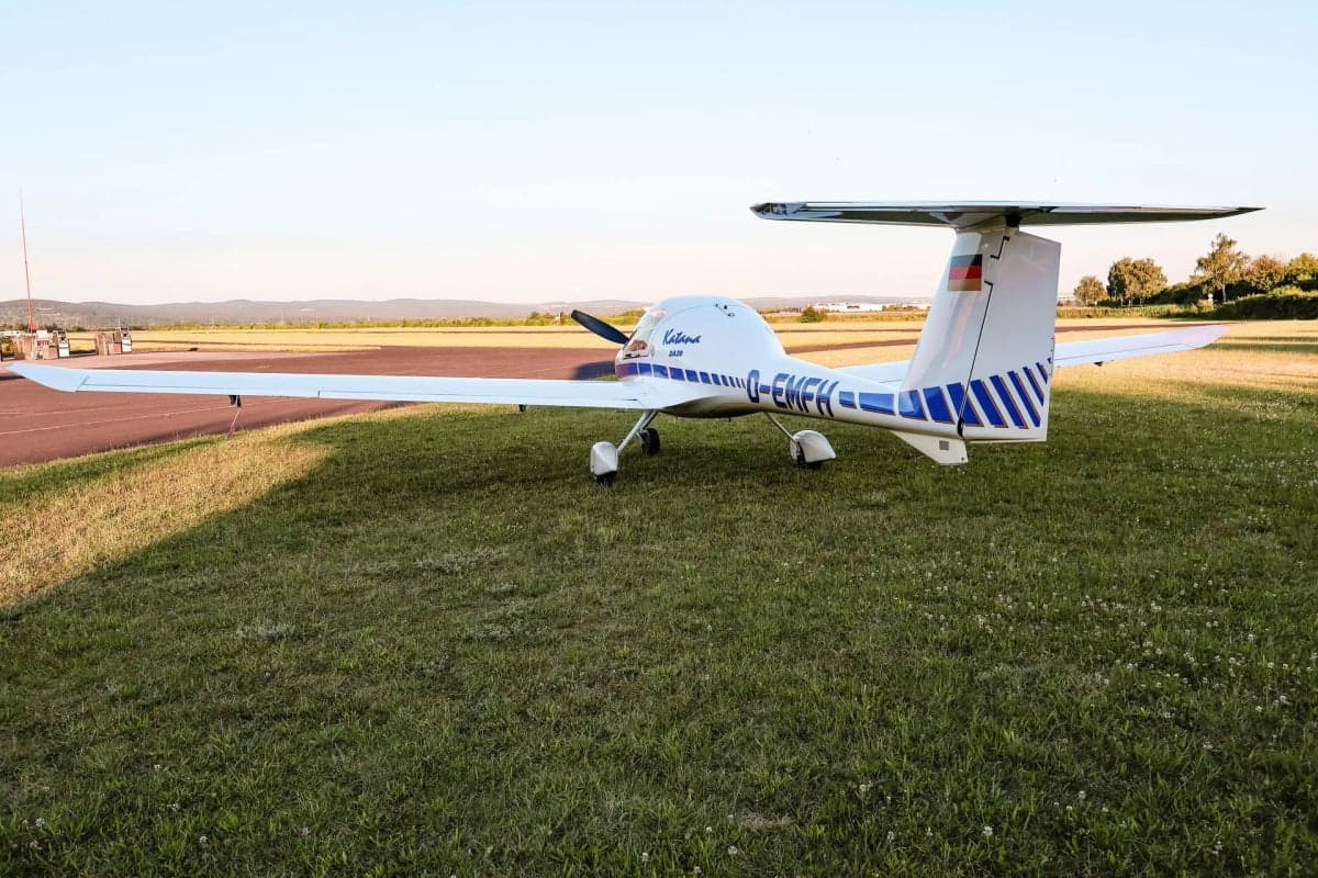 Diamond DA20 Katana D-EMFH parked on grass at an airfield.