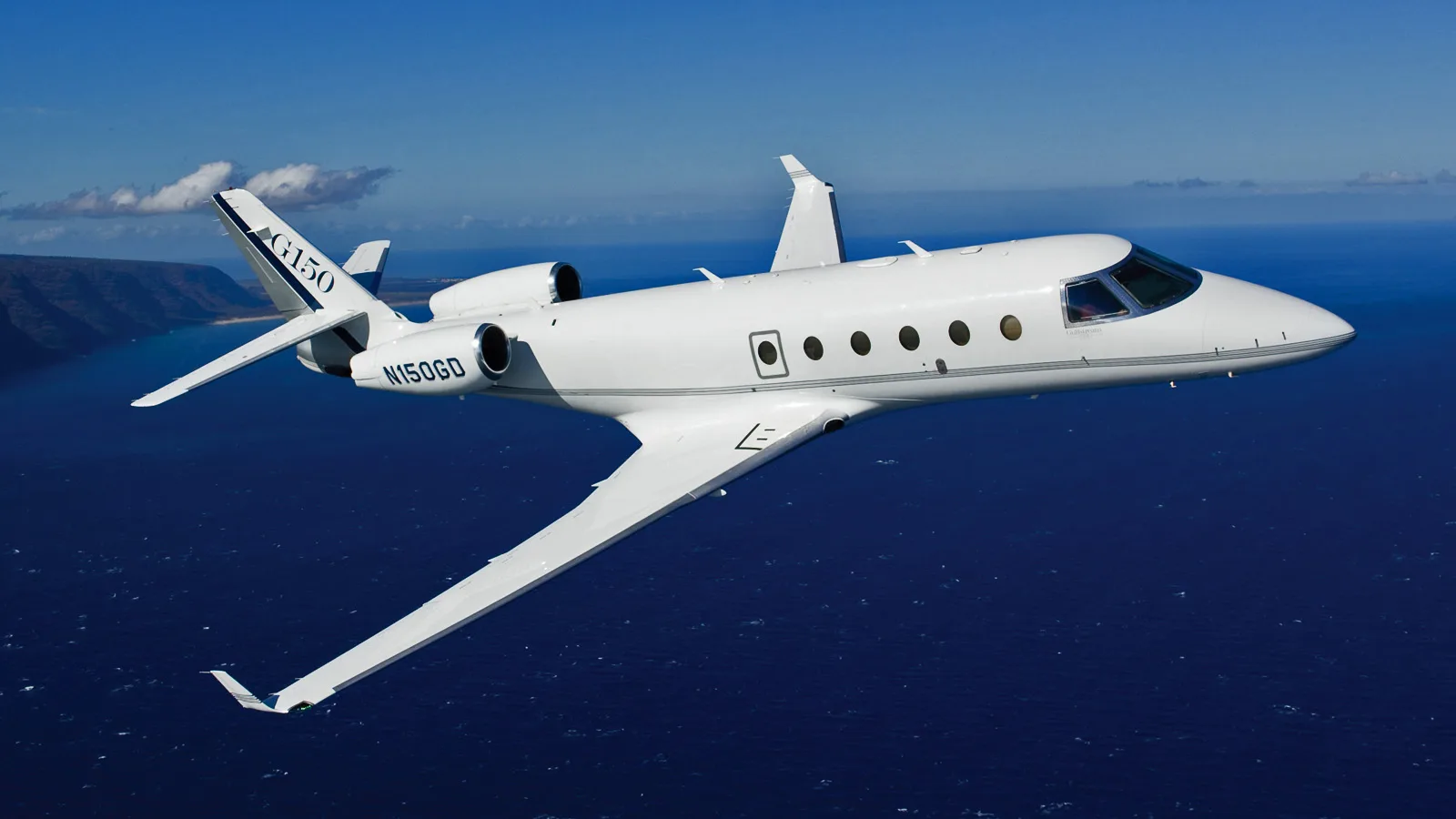 Gulfstream G150 in flight over the ocean.